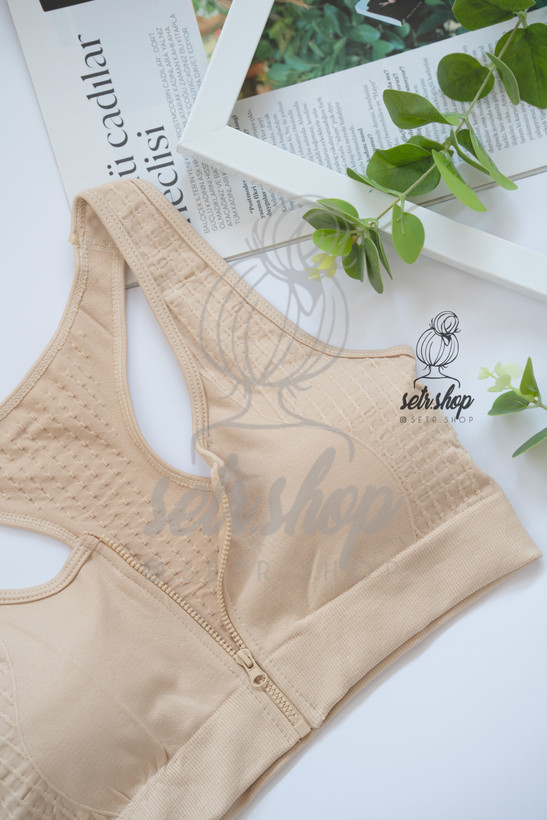 نیمتنه ورزشی زنانه جلو زیپدار با کاپ متحرک در سایزبندی M تا XXL و رنگهای صورتی، کرم، آبی، طوسی، بنفش